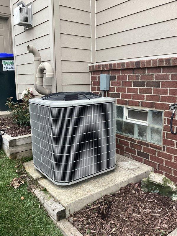 Conducted comprehensive evaluation of 16-year-old residential HVAC system for replacement estimate. Inspected indoor furnace/air handler unit located in basement utility area and outdoor condensing unit positioned on concrete pad adjacent to home's exterior. Assessed current system condition, documented existing equipment configuration including condensate drainage system and thermostat controls, and photographed both indoor and outdoor components to provide complete replacement proposal for aging climate control system.