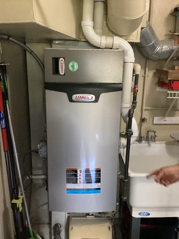 Provided replacement estimate for non-operational air conditioning system with existing 20+ year old Lennox HVAC equipment located in utility room. Assessed current furnace setup with natural gas fuel source, documented existing installation configuration including ductwork connections, PVC condensate piping, and mechanical room layout. Prepared comprehensive equipment replacement recommendations for complete system upgrade.
