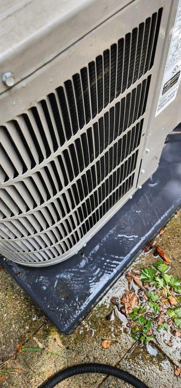 Completed comprehensive AC maintenance inspection on outdoor condensing unit. Performed visual assessment of evaporator coil assembly, noting intact metallic fins and proper copper refrigerant line connections. Inspected condenser unit exterior, confirmed operational grille assembly and manufacturer specifications visible. Documented minor debris accumulation around base pad and exterior housing, consistent with normal outdoor installation conditions. Unit showing typical weathering with functional components intact. All system elements photographed for maintenance records.
