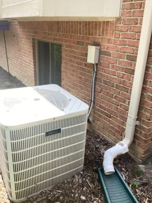 Conducted on-site evaluation of existing HVAC system for full replacement estimate. Assessed outdoor air conditioning unit mounted on exterior brick wall with associated electrical disconnect, refrigerant lines, and condensate drainage system. Evaluated indoor furnace installation in basement mechanical room, including supply and return ductwork, gas connections, and venting configuration. Documented equipment specifications, installation conditions, and spatial requirements through photographic documentation. Provided homeowner with comprehensive replacement options for both heating and cooling equipment based on current system layout and operational status.
