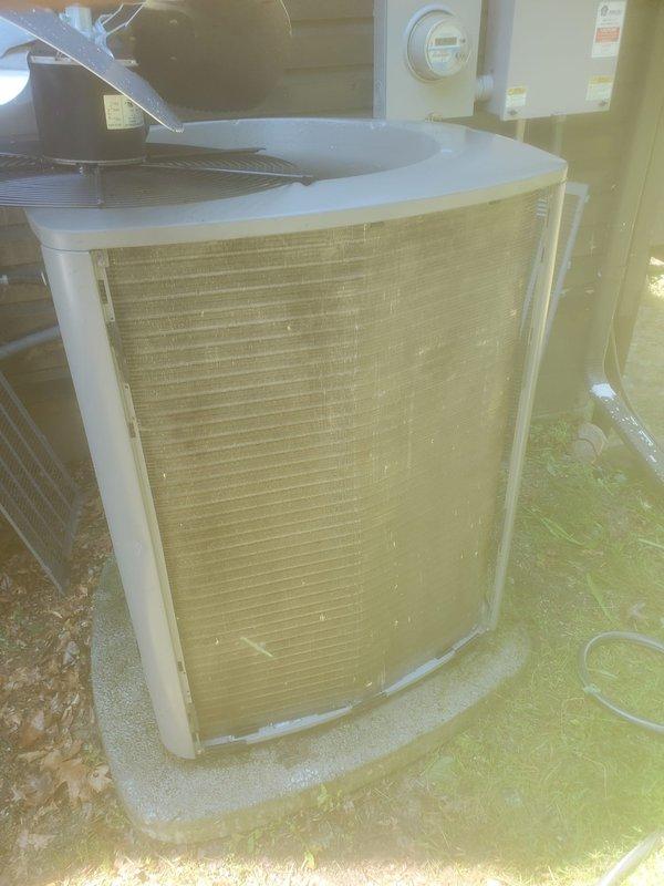 Completed comprehensive AC maintenance on cooling system. Inspected indoor evaporator coil assembly and condensate drain pan, noting standing water present with copper refrigerant lines and drainage connections functioning properly. Evaluated outdoor condensing unit including fan assembly, cabinet condition, and electrical connections. Customer advised that current maintenance visit falls outside coverage period and service agreement renewal is required for future covered maintenance visits.
