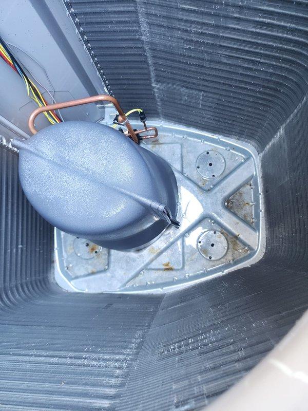 Completed comprehensive summer maintenance on 8-year-old outdoor air conditioning system. Performed standard AC tune-up procedures including inspection of condenser unit, which showed significant accumulation of dirt, debris, and grime on exterior grilles and fins requiring cleaning. Inspected internal components including heat exchange coils, refrigerant lines, pressure bladder, and electrical connections—all found to be in satisfactory operating condition with no issues identified or repairs needed.