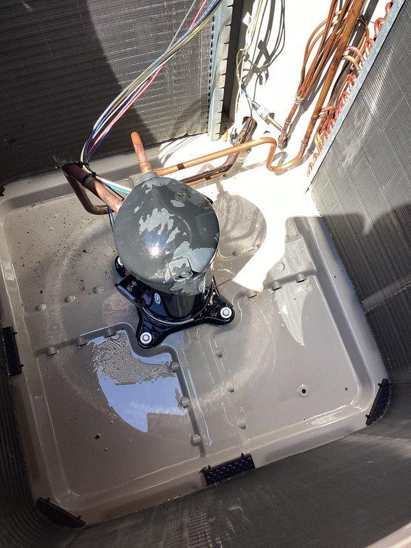 Performed comprehensive preventative maintenance on 3-year-old residential air conditioning system. Inspection revealed condenser coils with accumulated debris and dust between fins, requiring thorough cleaning to maintain optimal heat transfer efficiency. Cleaned and straightened condenser coil fins, removed debris buildup, and verified proper drainage from condensate pan which showed normal moisture accumulation. Inspected compressor unit, refrigerant lines, and electrical connections—all components found to be in good operating condition with no refrigerant leaks detected. Copper line sets and mounting hardware secure with no signs of wear or damage. System operating within normal parameters upon completion of tune-up service.