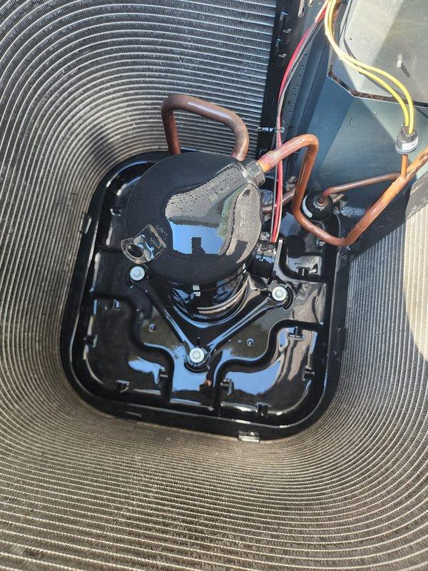 Completed preventive maintenance inspection on residential split-system air conditioning unit. Performed visual examination of outdoor condensing unit, confirming proper condition of protective grille, condenser coil fins, compressor assembly, and refrigerant line connections. All major components including compressor, condenser coils, and electrical connections were inspected and found to be in satisfactory operating condition with no immediate service needs identified.