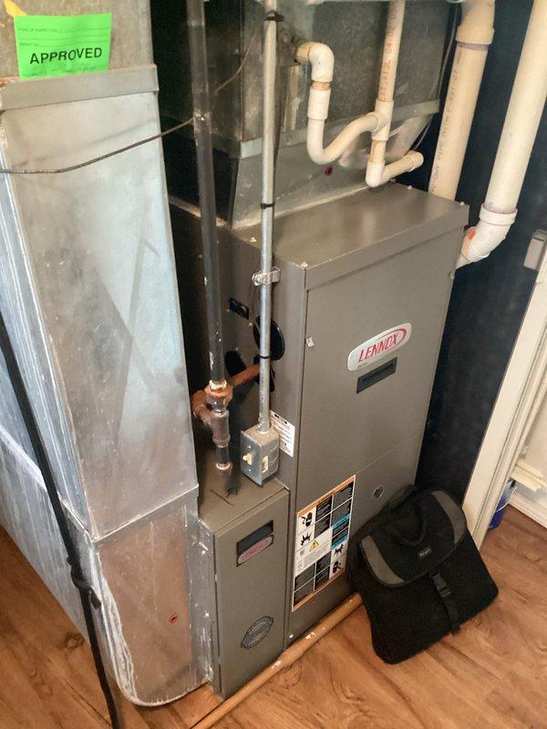 Completed comprehensive HVAC system replacement estimate for residential property. Assessed existing Lennox furnace and air handler installation in utility closet, documenting current equipment configuration including condensate drain lines, copper refrigerant lines, gas connections, and electrical components. Photographed equipment layout, clearances, and mechanical room conditions to provide accurate replacement specifications and system sizing recommendations.
