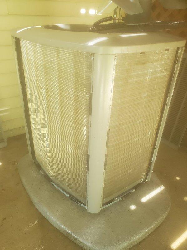 Completed comprehensive cooling season maintenance inspection on residential air conditioning system. Inspected and documented V-shaped air filter assembly with dual pleated panels in proper operating condition, examined refrigerant line connections, electrical wiring harness, and evaporator coil assembly for proper operation and system integrity. All components found functioning within normal parameters with no immediate service concerns identified.