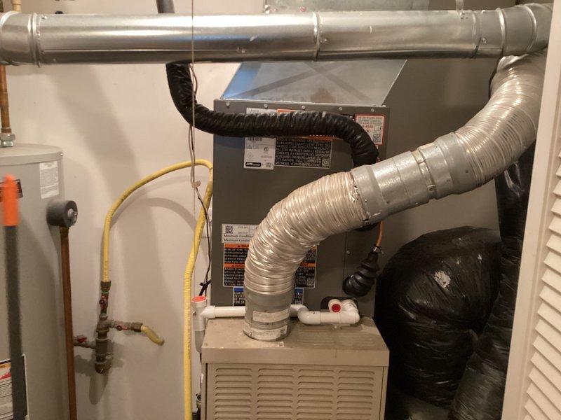 Completed installation of new Lennox air conditioning system including outdoor condensing unit and indoor air handler with associated ductwork connections. Connected refrigerant lines, electrical service, and condensate drainage; verified proper system operation and airflow throughout. Payment collected upon successful completion of installation.