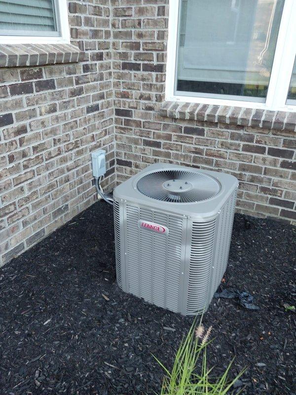 Responded to no cooling complaint on 7-year-old Lennox air conditioning system located at exterior of residence. Upon arrival, performed diagnostic inspection of outdoor condensing unit positioned against brick wall in mulch bed. Verified unit power supply at electrical disconnect box and checked all electrical connections. Evaluated condenser operation, refrigerant levels, and overall system performance to identify cause of cooling failure and restore proper air conditioning function.