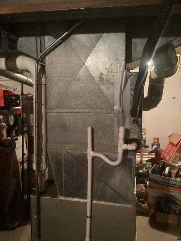 Provided estimate for complete HVAC system replacement of 34-year-old non-operational air conditioning unit and air handler located in basement mechanical room. Assessment revealed aged equipment with significant deterioration, moisture accumulation on air handler cabinet, and overall system failure requiring full replacement rather than repair.
