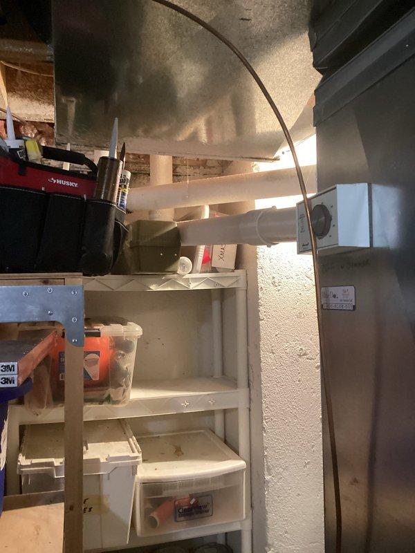 Completed comprehensive estimate for furnace and air conditioning system replacement on 26-year-old equipment. Assessed existing HVAC infrastructure in basement utility area, including ductwork configuration, electrical service panel, and available space for new equipment installation. Documented current system layout with photographs showing metallic rectangular ductwork, electrical components, and mechanical room conditions to provide accurate replacement specifications and installation requirements.
