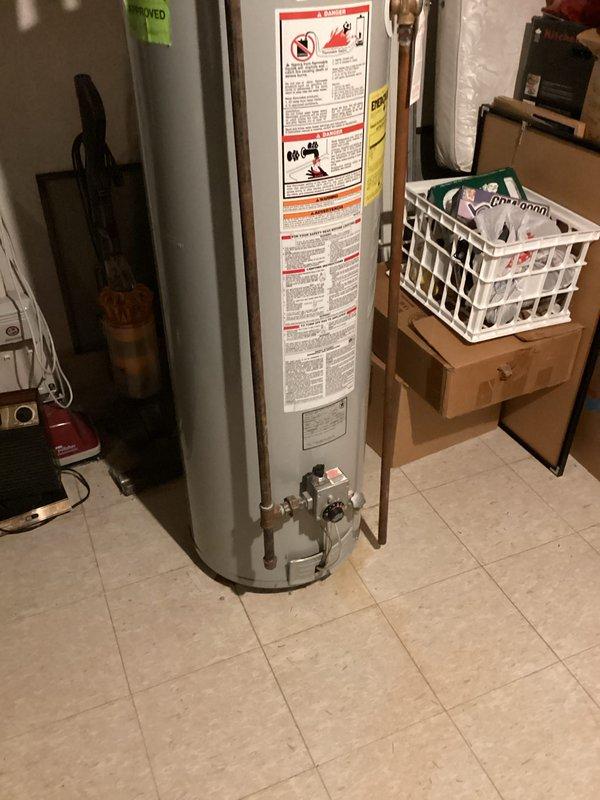 Conducted comprehensive assessment of existing residential water heater installation in basement utility area for replacement estimate. Evaluated current unit specifications, plumbing connections including copper supply lines with brass fittings and shut-off valves, PVC venting configuration, and clearance requirements for new equipment installation. Documented existing system configuration with photographs showing current water heater condition, piping layout, and surrounding mechanical room space to provide accurate replacement proposal. Coordinated visit with scheduled air conditioning maintenance service for customer convenience.
