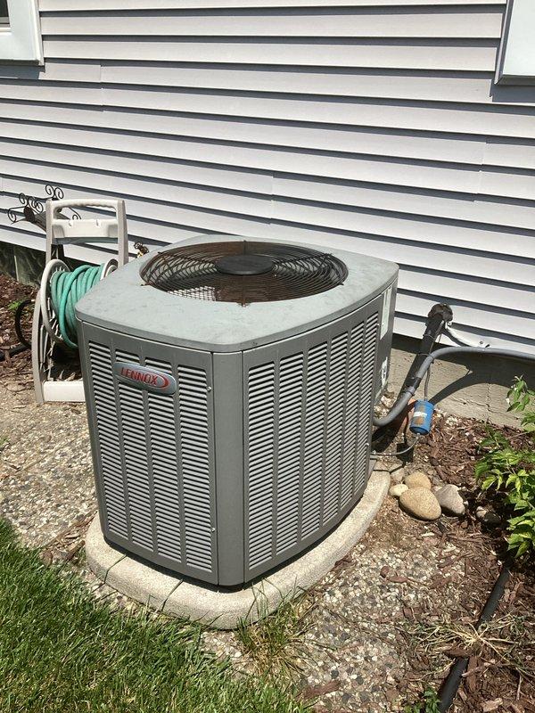 Conducted comprehensive site evaluation for complete HVAC system replacement of 31-year-old Lennox unit. Assessed outdoor condenser positioned on concrete pad with hexagonal configuration and existing refrigerant line routing, as well as indoor air handler installation in basement mechanical room with associated ductwork connections. Documented current system configuration including insulated supply ductwork, flexible transitions, and equipment mounting arrangements to develop accurate replacement estimate, with installation scheduling pending customer availability for therapy appointments.