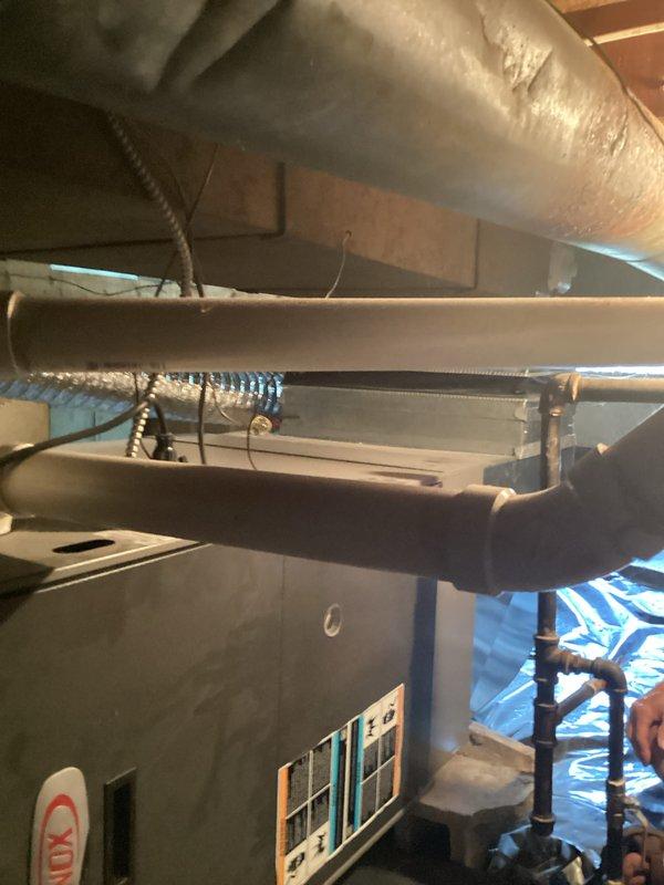 Conducted comprehensive site evaluation for complete HVAC system replacement of 31-year-old Lennox unit. Assessed outdoor condenser positioned on concrete pad with hexagonal configuration and existing refrigerant line routing, as well as indoor air handler installation in basement mechanical room with associated ductwork connections. Documented current system configuration including insulated supply ductwork, flexible transitions, and equipment mounting arrangements to develop accurate replacement estimate, with installation scheduling pending customer availability for therapy appointments.