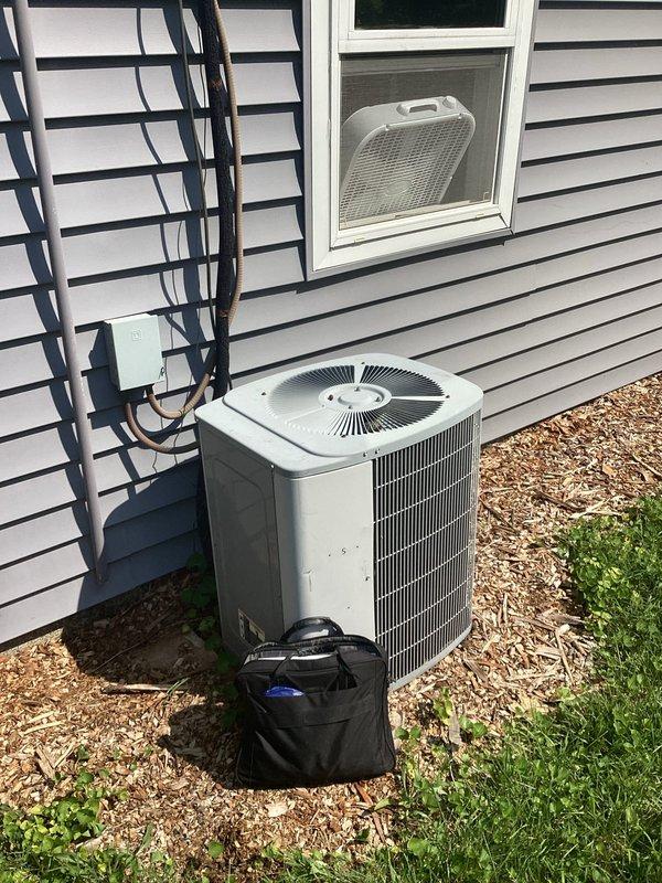 Responded to whole house AC system failure caused by condenser radiator leak resulting in complete refrigerant loss. Upon inspection, confirmed the existing refrigerant type has been discontinued, making repair economically unfeasible. Evaluated outdoor condenser unit positioned on side of residence and air handler located in attic space. Documented existing system configuration including ductwork routing and insulation conditions in attic installation area. Provided comprehensive replacement estimate for new complete HVAC system to restore cooling functionality to the residence.