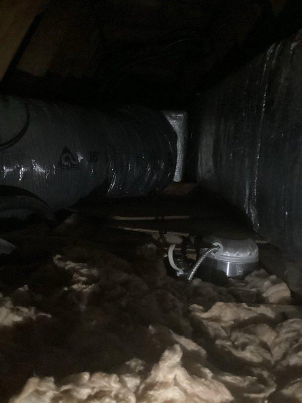 Responded to whole house AC system failure caused by condenser radiator leak resulting in complete refrigerant loss. Upon inspection, confirmed the existing refrigerant type has been discontinued, making repair economically unfeasible. Evaluated outdoor condenser unit positioned on side of residence and air handler located in attic space. Documented existing system configuration including ductwork routing and insulation conditions in attic installation area. Provided comprehensive replacement estimate for new complete HVAC system to restore cooling functionality to the residence.