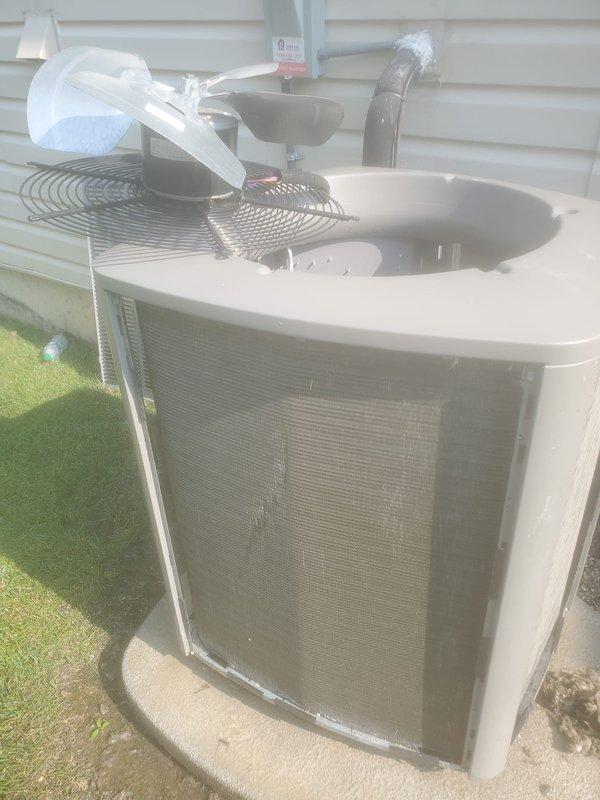 Completed preventative maintenance inspection on residential split system air conditioning unit. During inspection, discovered evaporator coil with significant frost and ice buildup indicating restricted airflow, low refrigerant charge, or other system malfunction requiring immediate attention. Documented outdoor condensing unit condition and indoor evaporator coil assembly with photographic evidence showing frozen coil surfaces and copper refrigerant lines covered in crystalline ice formation. System requires diagnostic evaluation and corrective action to resolve freezing condition before normal operation can resume.