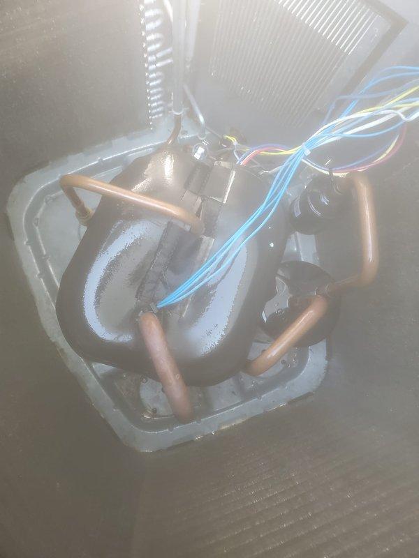 Completed preventative maintenance inspection on residential split system air conditioning unit. During inspection, discovered evaporator coil with significant frost and ice buildup indicating restricted airflow, low refrigerant charge, or other system malfunction requiring immediate attention. Documented outdoor condensing unit condition and indoor evaporator coil assembly with photographic evidence showing frozen coil surfaces and copper refrigerant lines covered in crystalline ice formation. System requires diagnostic evaluation and corrective action to resolve freezing condition before normal operation can resume.