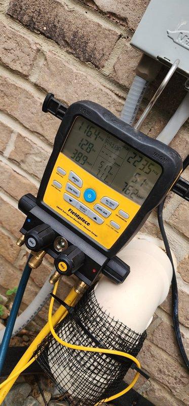 Completed preventative maintenance service on dual air conditioning system. Performed comprehensive system diagnostics using manifold gauge set to verify refrigerant pressures and temperatures on both units. Inspected outdoor condensing units, confirmed proper airflow through condenser coils, checked electrical connections, and verified compressor operation. Both systems operating within normal parameters with no deficiencies noted.