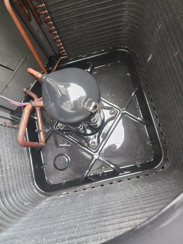 Completed preventive maintenance tune-up on 5-year-old residential air conditioning system with outdoor condenser unit and basement air handler. Performed comprehensive inspection of both indoor and outdoor components, including checking refrigerant levels, testing electrical connections, cleaning condenser coils, and verifying proper system operation. Noted standing water present in drain pan of indoor unit, which was addressed during service; outdoor unit showed normal wear and debris accumulation for age and was cleaned as part of routine maintenance protocol.