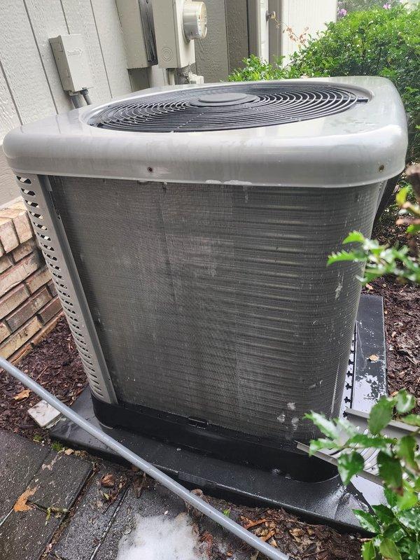 Completed preventive maintenance tune-up on 5-year-old residential air conditioning system with outdoor condenser unit and basement air handler. Performed comprehensive inspection of both indoor and outdoor components, including checking refrigerant levels, testing electrical connections, cleaning condenser coils, and verifying proper system operation. Noted standing water present in drain pan of indoor unit, which was addressed during service; outdoor unit showed normal wear and debris accumulation for age and was cleaned as part of routine maintenance protocol.