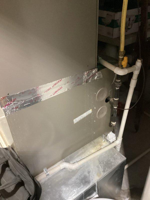 Conducted comprehensive assessment of existing HVAC system that has reached end of service life and experiencing declining performance. System evaluation revealed aging air handler unit and ductwork assembly in basement utility area showing signs of wear and reduced operational efficiency. Documented current installation configuration including vertical metal ductwork, evaporator coil assembly, refrigerant line routing, and existing insulation conditions. Provided detailed replacement estimate for complete system upgrade to restore proper climate control and energy efficiency to the residence.