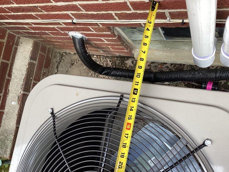 Completed warranty follow-up for failed inspection on outdoor HVAC condensing unit installation. Installed weatherproof connector from meter to disconnect and GFCI outlet at AC unit location per code requirements. Relocated and adjusted condensing unit positioning to achieve manufacturer-specified minimum clearances from brick wall foundation and adjacent structures, verified with measurements. Sealed all wall penetrations with approved fire-stop materials where refrigerant lines, electrical conduit, and drainage piping enter building envelope. Documented final installation with photographs showing proper unit clearances, compliant electrical connections, and sealed penetrations for inspection approval.