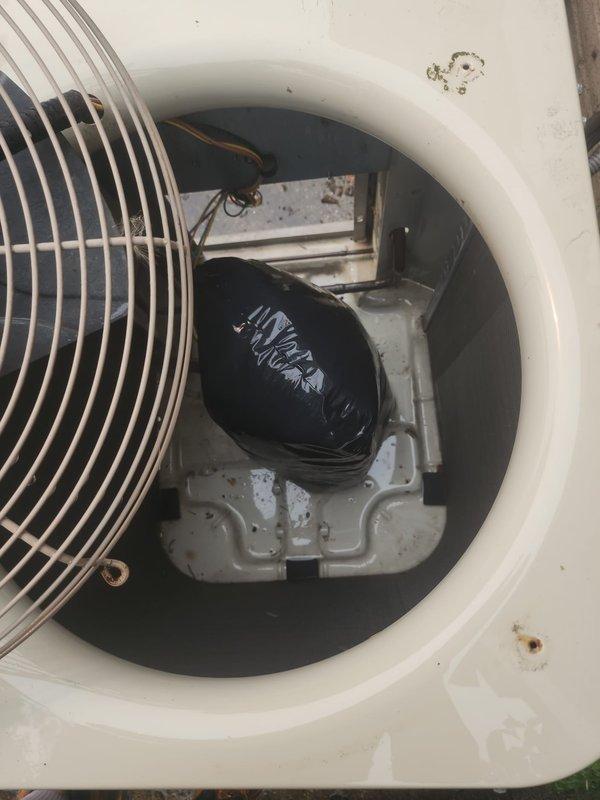 Completed annual preventive maintenance on a 10-year-old outdoor air conditioning condenser unit. Performed comprehensive tune-up including inspection of all accessible components, verified proper operation of condenser fan and motor assembly, checked electrical connections and controls, and examined cabinet condition. Unit showed normal age-related weathering with minor surface rust and accumulated debris but no operational deficiencies were identified. Cleaned condenser coils, removed debris from interior cavity, and confirmed system is operating within normal parameters with no reported issues from customer.
