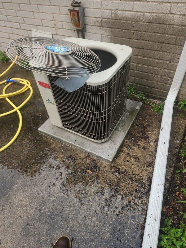 Completed annual preventive maintenance on a 10-year-old outdoor air conditioning condenser unit. Performed comprehensive tune-up including inspection of all accessible components, verified proper operation of condenser fan and motor assembly, checked electrical connections and controls, and examined cabinet condition. Unit showed normal age-related weathering with minor surface rust and accumulated debris but no operational deficiencies were identified. Cleaned condenser coils, removed debris from interior cavity, and confirmed system is operating within normal parameters with no reported issues from customer.