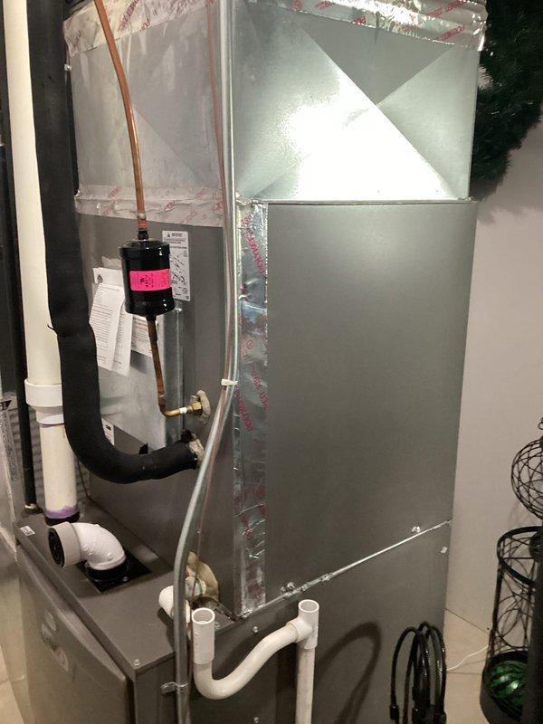 Completed estimate for replacement of 13-year-old air conditioning system experiencing refrigerant loss. Evaluated existing air handler unit with ductwork connections and assessed overall system condition for full replacement recommendation. Account information verified and service credit applied toward future installation.