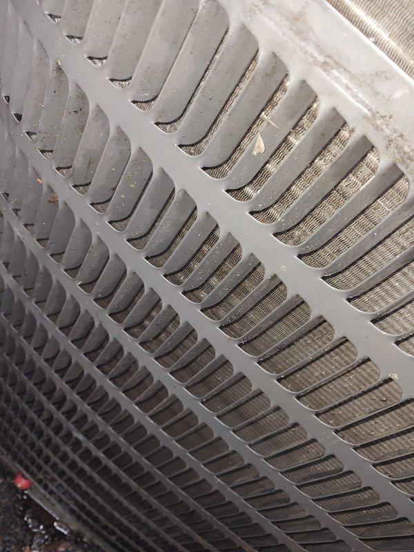 Performed complimentary second opinion evaluation of existing air conditioning system at homeowner's request to assess recommendations provided by another contractor. Conducted thorough visual inspection of outdoor condensing unit, noting significant accumulation of dust and debris restricting airflow through condenser coil fins. Examined indoor evaporator unit components including condensate drain pan and pump assembly, observing rust formation, water staining, and debris buildup in drain pan indicating potential drainage concerns. Documented current equipment condition through photographs for homeowner review. Provided professional assessment of system maintenance needs and discussed replacement options for consideration.