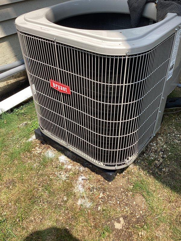 Responded to service call for A/C system blowing warm air during afternoon hours. Upon inspection, found Bryant condensing unit operational with proper airflow through exterior grille. Examined indoor evaporator coil assembly and associated components including refrigerant lines, electrical connections, and safety devices. Verified all copper line connections secure, electrical wiring properly terminated, and float switch functioning correctly. System restored to normal cooling operation with no further issues detected.