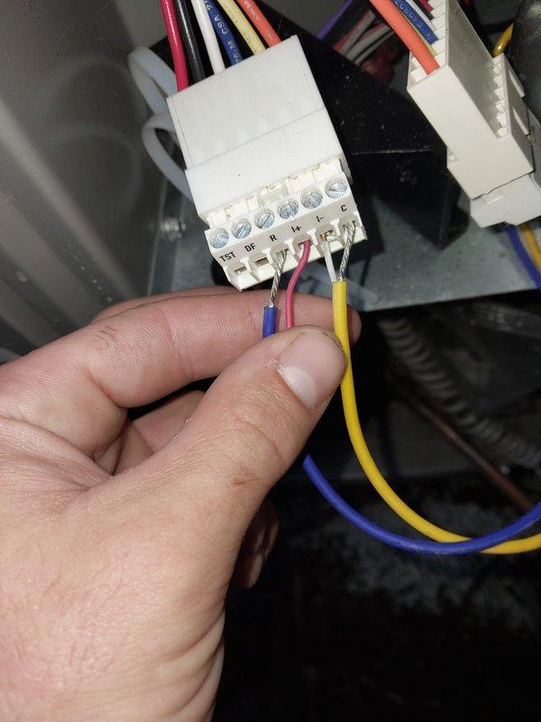Responded to Error 31 communication fault on HVAC system. Inspected control board wiring connections and wire harness terminals, verified all multi-conductor connections were properly seated at the PCB terminal blocks. System was operational and cooling normally at time of service, with no active fault codes present upon arrival as error had been previously reset.
