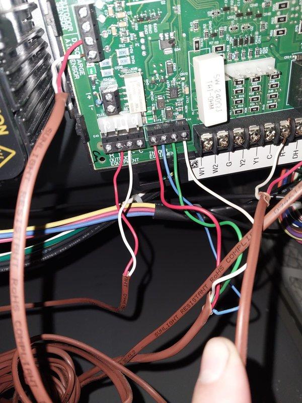 Responded to Error 31 communication fault on HVAC system. Inspected control board wiring connections and wire harness terminals, verified all multi-conductor connections were properly seated at the PCB terminal blocks. System was operational and cooling normally at time of service, with no active fault codes present upon arrival as error had been previously reset.