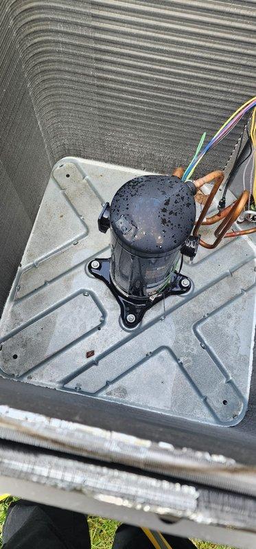 Completed annual AC tune-up on 2-year-old residential air conditioning system. Performed comprehensive maintenance inspection of outdoor condensing unit, verified compressor operation and electrical connections, and documented heavy accumulation of dirt and debris on evaporator coil fins requiring attention to maintain optimal system efficiency and airflow.
