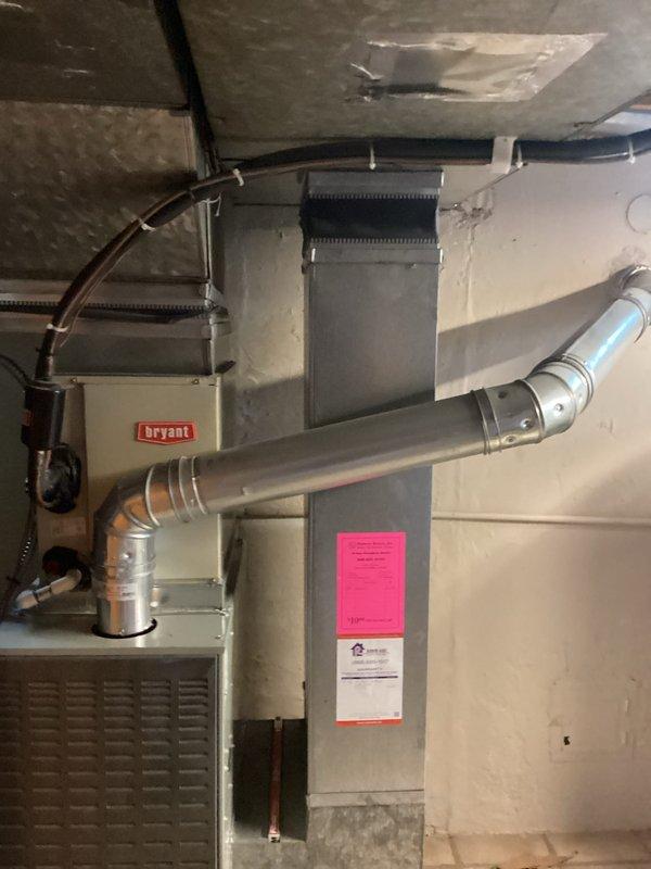 Completed HVAC system replacement estimate for residential property with low refrigerant condition. Assessed existing Bryant furnace/air handler unit in basement and outdoor condenser unit, documenting current installation including ductwork configuration, refrigerant lines, and electrical connections. Applied available service credit toward replacement recommendation.