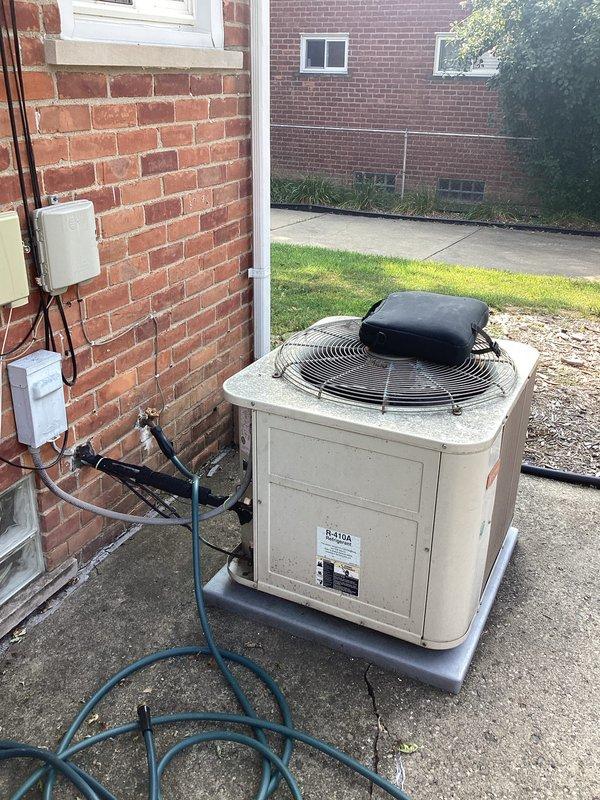 Completed HVAC system replacement estimate for residential property with low refrigerant condition. Assessed existing Bryant furnace/air handler unit in basement and outdoor condenser unit, documenting current installation including ductwork configuration, refrigerant lines, and electrical connections. Applied available service credit toward replacement recommendation.