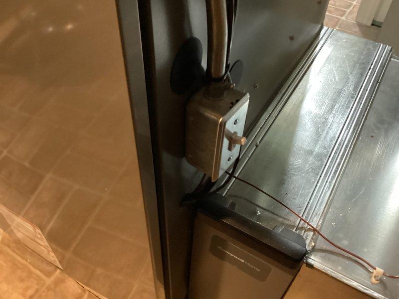 Successfully installed two complete Lennox HVAC systems with integrated humidifiers in a dual-zone configuration. Both systems include Milano smart thermostats (Model 108296-01) with full programming capabilities, properly configured zone controls, and all necessary ductwork and plenums securely mounted in the attic space with appropriate access panels and latching mechanisms.