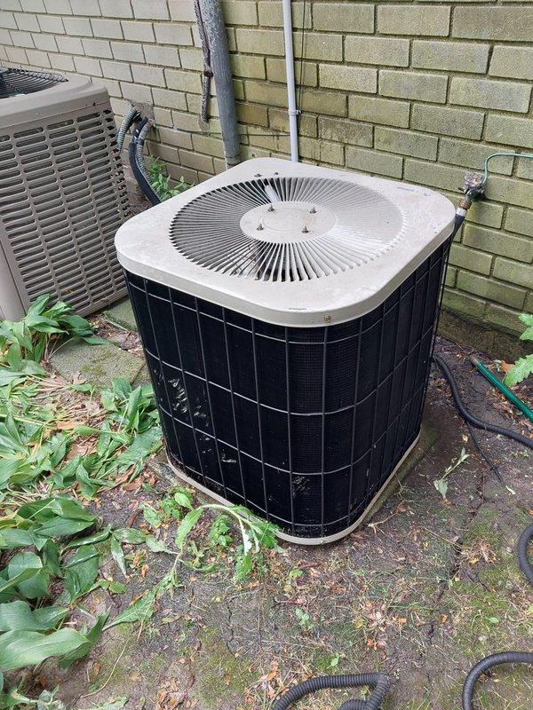 Completed preventative maintenance on two residential air conditioning systems under Worry Free Service Agreement. Performed comprehensive inspection of both condenser units, including newer black-caged unit and older tan-housed system. Inspected compressor operation, copper refrigerant lines, electrical connections, and conduit routing on both units. Noted age-related wear on compressor components and rust staining on mounting base of older system. Verified proper operation of both systems and documented equipment condition. Customer enrolled in DTE energy rebate program for electricity savings.
