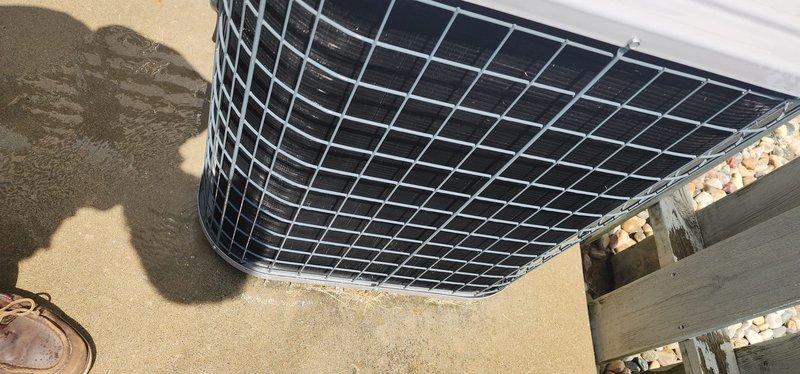 Completed routine cooling system maintenance inspection on residential air conditioning unit. Exterior condenser unit examined and photographed showing proper placement on concrete pad with adequate clearance and protective grille in good condition. Interior air handler inspection revealed significant frost accumulation on evaporator coil and refrigerant lines, indicating potential low refrigerant charge or restricted airflow issue requiring further diagnostic evaluation and corrective action to restore proper system operation.