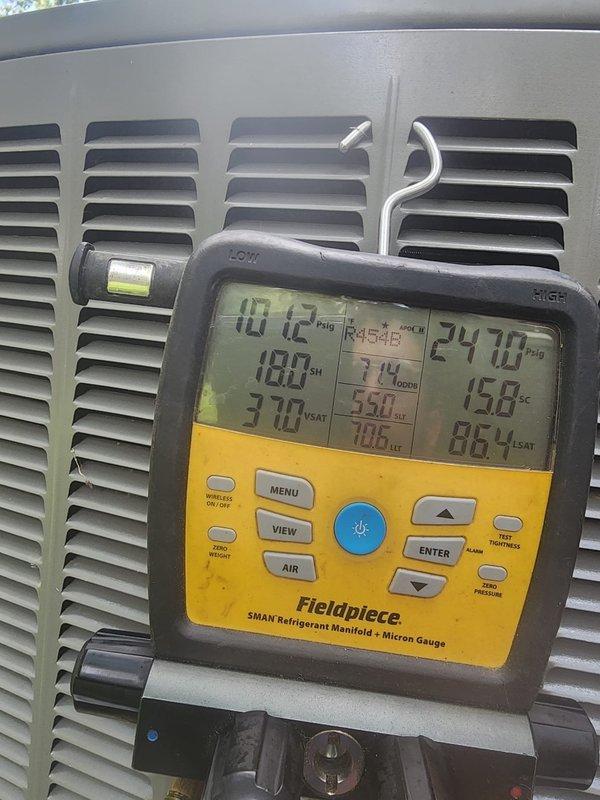 Responded to no cooling call on Lennox air conditioner in basement with 411 alarm on pressure switch. Upon inspection, tested system pressures using refrigerant manifold gauge, which showed suction pressure of 10.12 PSIG and discharge pressure of 247.8 PSIG with corresponding temperatures. Inspected evaporator coil assembly and found unit operational after diagnostics, with pressure switch alarm likely triggered by temporary pressure imbalance that cleared during testing.