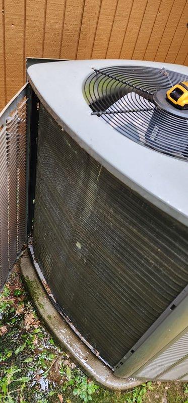 Completed scheduled preventive maintenance on residential split-system air conditioning unit. Performed comprehensive inspection of outdoor condenser unit, including visual assessment of cabinet condition, fan operation, and refrigerant line connections. Noted exterior mesh screening shows accumulated dirt and biological growth requiring cleaning attention. Unit operational and cooling system functioning within normal parameters at time of service.
