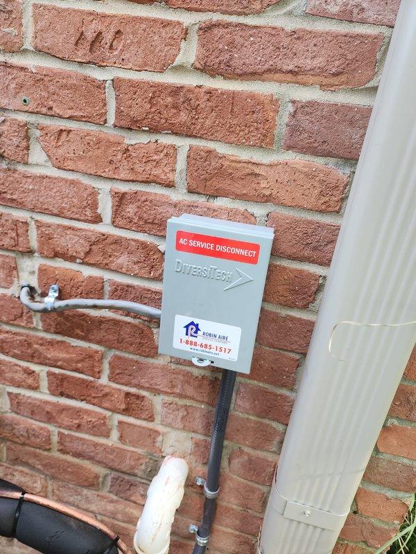 Completed full HVAC system installation including Lennox furnace, air conditioner, and S40 smart thermostat. Reinstalled existing humidifier and integrated with new system. Installed AC service disconnect box on exterior brick wall with proper conduit routing, established PVC venting through exterior siding for furnace exhaust and intake, and verified all electrical connections and refrigerant lines. System tested and operational.