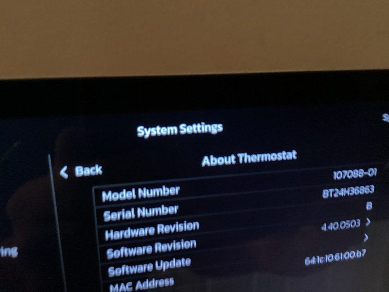Completed installation of Lennox air conditioning system, model number 10Z085-01. System was fully commissioned with thermostat programmed and configured to display proper system settings, hardware revision 4.40.0503 confirmed operational, and all mechanical components installed in basement location with ductwork connections secured to existing infrastructure.