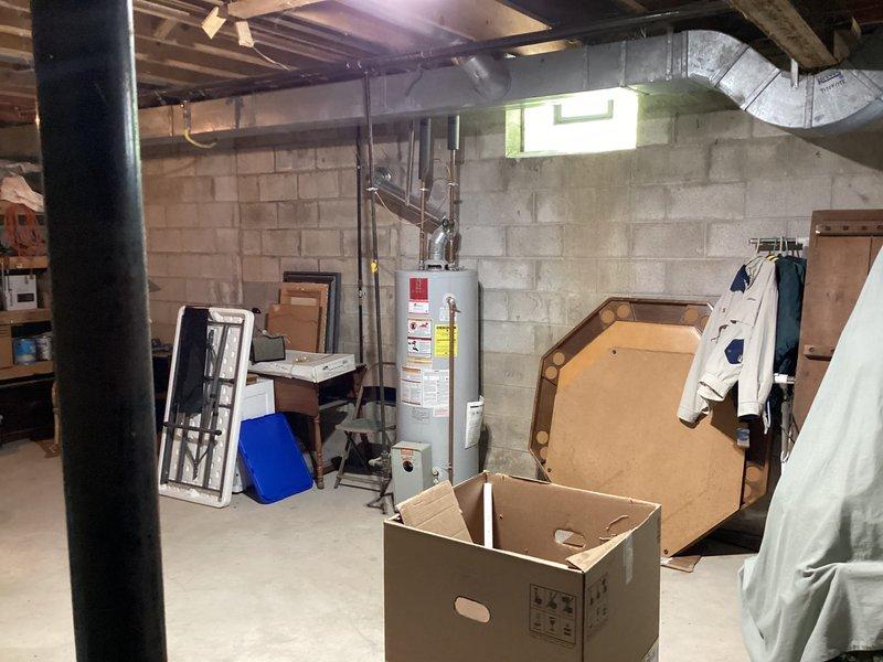 Completed installation of Lennox air conditioning system, model number 10Z085-01. System was fully commissioned with thermostat programmed and configured to display proper system settings, hardware revision 4.40.0503 confirmed operational, and all mechanical components installed in basement location with ductwork connections secured to existing infrastructure.