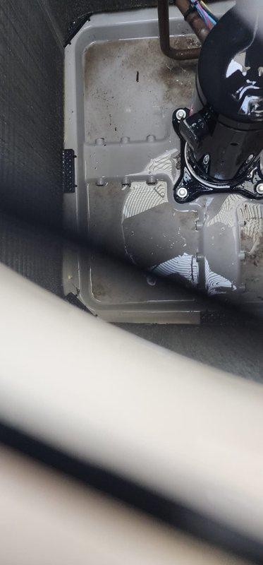 Performed routine air conditioning maintenance on residential system. Inspected indoor evaporator coil assembly and condensate drain pan, noting accumulated debris and sediment requiring monitoring. Serviced outdoor condenser unit, completing standard tune-up procedures including coil cleaning and operational testing to ensure proper system performance for cooling season.