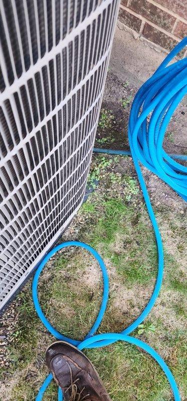 Performed routine air conditioning maintenance on residential system. Inspected indoor evaporator coil assembly and condensate drain pan, noting accumulated debris and sediment requiring monitoring. Serviced outdoor condenser unit, completing standard tune-up procedures including coil cleaning and operational testing to ensure proper system performance for cooling season.