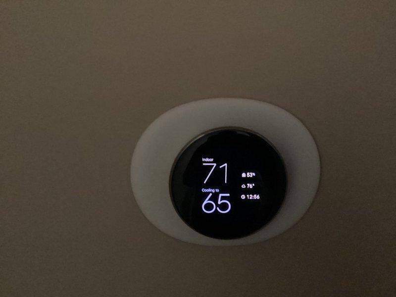 Completed installation of Bryant air conditioning system with Air Scrubber and humidifier integration. New smart thermostat programmed and operational, displaying proper cooling function and humidity monitoring capabilities. All equipment tested and verified working within manufacturer specifications.