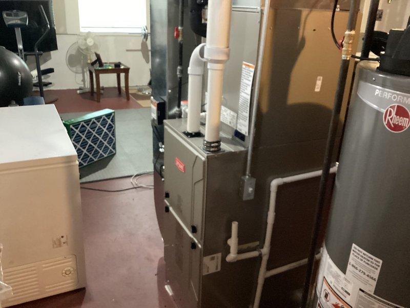 Completed installation of Bryant air conditioning system with Air Scrubber and humidifier integration. New smart thermostat programmed and operational, displaying proper cooling function and humidity monitoring capabilities. All equipment tested and verified working within manufacturer specifications.