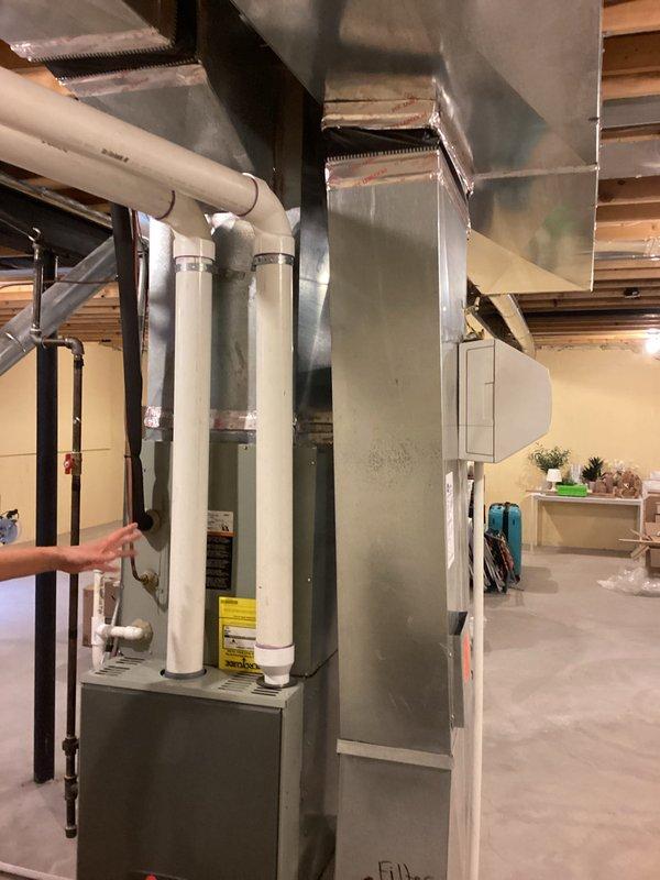Conducted comprehensive estimate for complete HVAC system replacement at residential property. Evaluated existing 19-year-old Trane furnace and 9-year-old air conditioning system located in unfinished basement utility area. Documented current equipment specifications, assessed ductwork configuration, and photographed existing installation including condensate drainage lines, PVC venting, and sheet metal distribution system. Provided homeowner with replacement options and recommendations based on equipment age and condition.