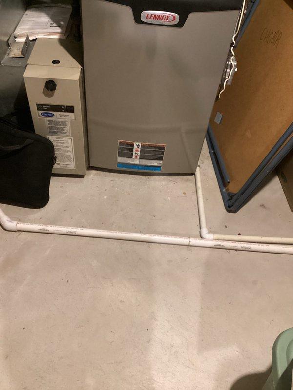 Provided comprehensive estimate for complete HVAC system replacement of 36-year-old non-operational air conditioning unit and aging Lennox furnace located in basement utility room. Assessed existing equipment configuration including ductwork, PVC condensate drainage system, copper refrigerant lines, and electrical connections to determine specifications for new system installation. Documented current setup with existing drain pan, humidifier component, and spatial constraints for replacement equipment sizing and placement recommendations.